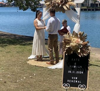 Bride and groom holding each other at their wedding vow renewal ceremony